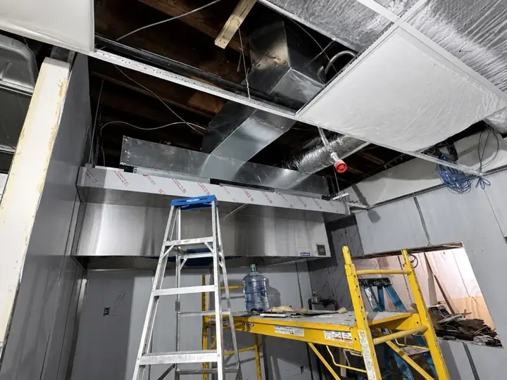 Large interior hood and duct system during installation