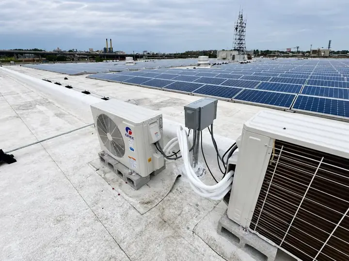 Rooftop HVAC equipment installed beside a solar array